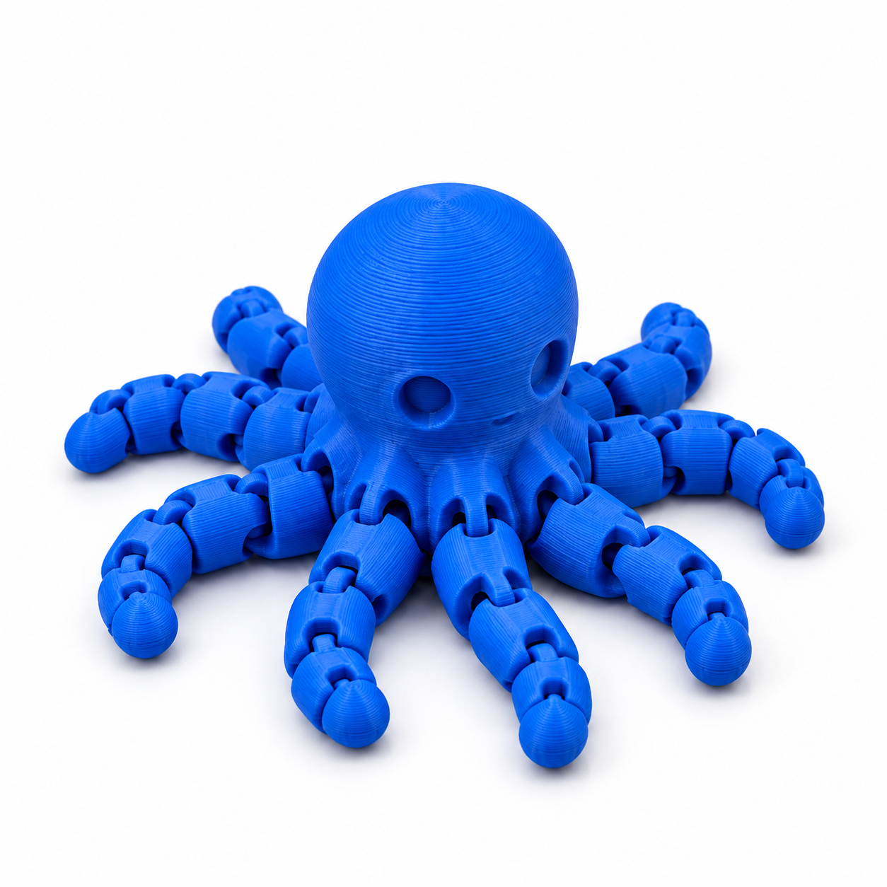 Blue articulated octopus with visible 3D print layers